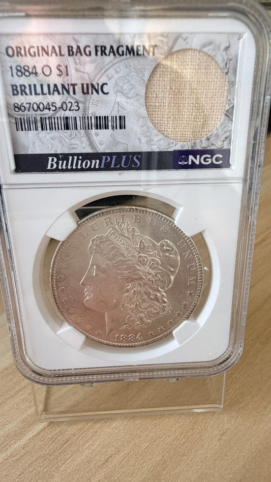 1884 O Morgan Dollar NGC Brilliant Unc Original Bag Fragment 90% Silver