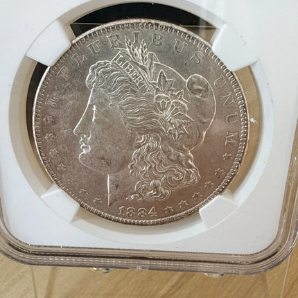 1884 O Morgan Dollar NGC Brilliant Unc Original Bag Fragment 90% Silver Genventro
