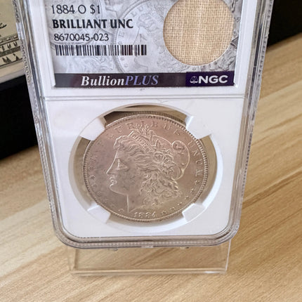1884 O Morgan Dollar NGC Brilliant Unc Original Bag Fragment 90% Silver Genventro
