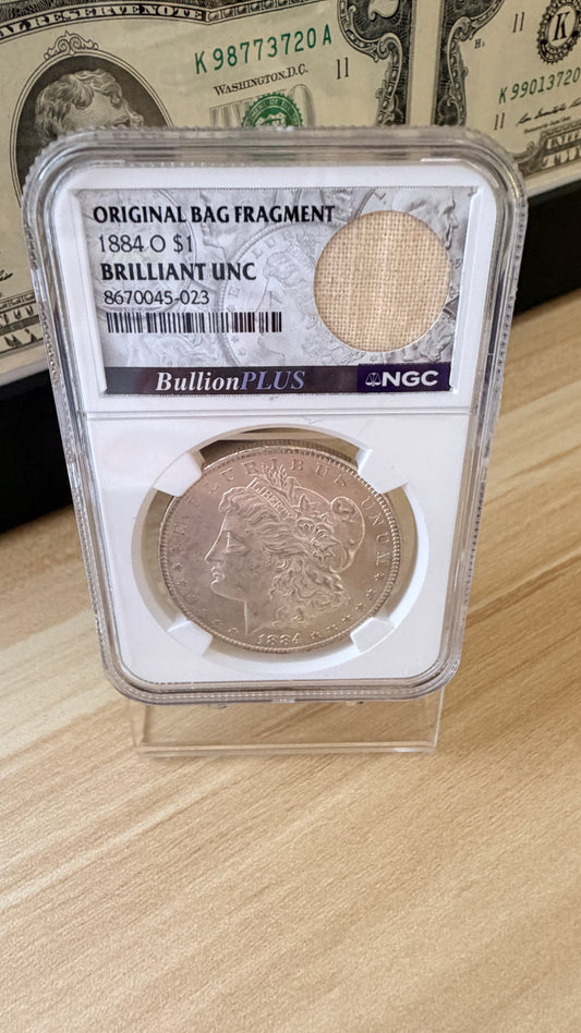 1884 O Morgan Dollar NGC Brilliant Unc Original Bag Fragment 90% Silver